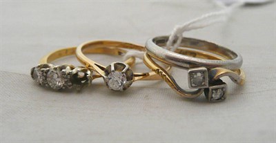 Lot 297 - Three diamond set rings and a wedding band