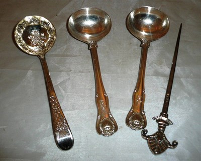 Lot 303 - A pair of small silver ladles, a Georgian silver ladle with later decoration and a silver...