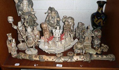 Lot 311 - A shelf of carved bone ornaments