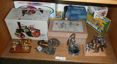 Lot 312 - Three hot air stationary engines, a Mamod steam roller and a quantity of reproduction tin plate...