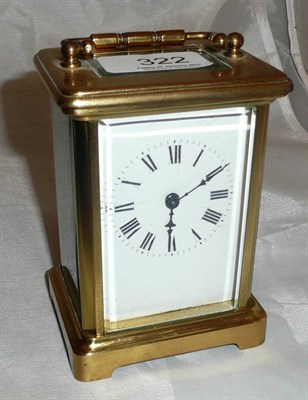 Lot 322 - A brass carriage clock with key