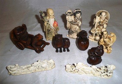 Lot 334 - Three carved wooden netsuke and seven other carvings