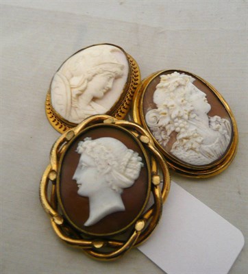 Lot 398 - Three cameo brooches, one depicting Bacchus, one a centurion and one a maiden's head