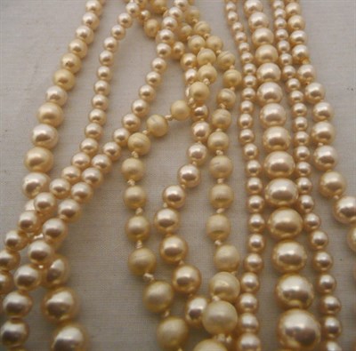 Lot 404 - Three pearl necklaces with 9ct gold clasps