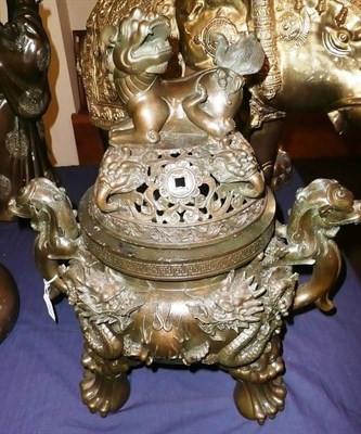 Lot 414 - A Chinese patinated metal koro and cover