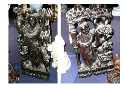 Lot 420 - A carved hardwood model of two figures with white metal inlay and another similar