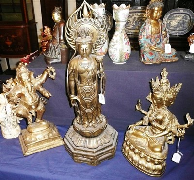 Lot 423 - A patinated bronze model of Ganesha, another of Buddha and another of Bodisatva (3)