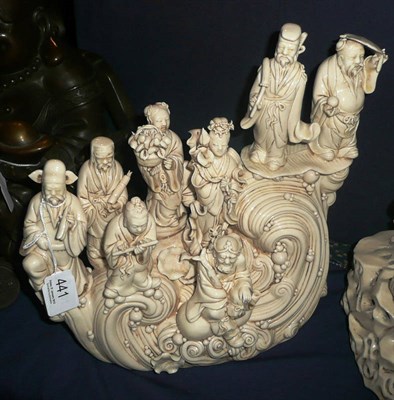 Lot 441 - A blanc de chine figure group of eight figures on a wave