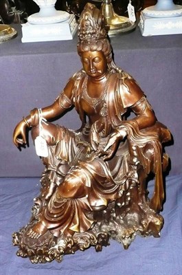 Lot 445 - A large patinated bronze deity