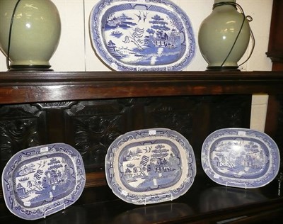 Lot 450 - Four large 19th century willow pattern meat dishes