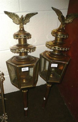 Lot 453 - A pair of brass coaching lamps mounted with eagles