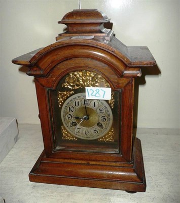 Lot 457 - An oak cased chiming mantel clock