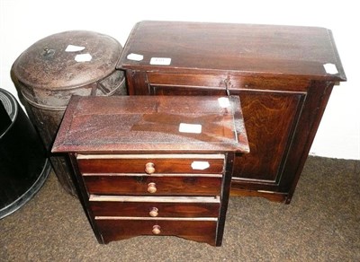 Lot 459 - A miniature chest of drawers, a stationery cupboard, a tin hat box and bonnet