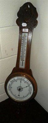 Lot 460 - A carved oak aneroid barometer