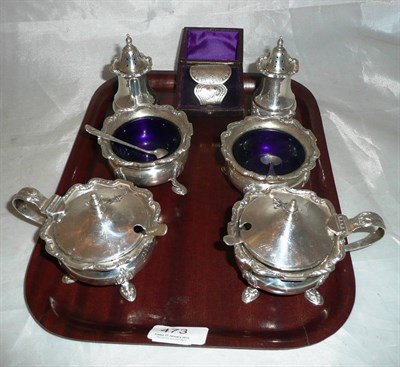 Lot 473 - A silver six piece cruet set and a cased napkin ring