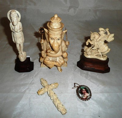 Lot 477 - An Indian carved ivory model of Shoien, a carved ivory cross and two other carvings etc