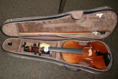 Lot 506 - A violin with bow, cased