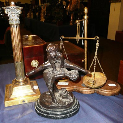 Lot 509 - A bronze of two children signed 'Barrie', a set of scales and a Corinthian column lamp base