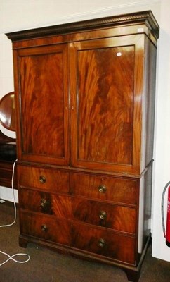 Lot 556 - A George III mahogany linen press (lacking drawers)