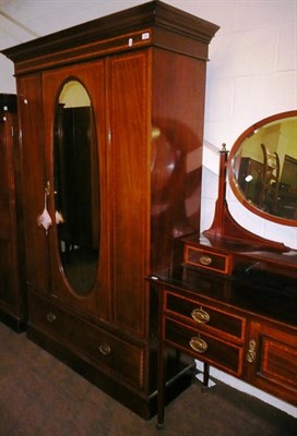 Lot 557 - An Edwardian inlaid mahogany wardrobe and a matching mirror back dressing table