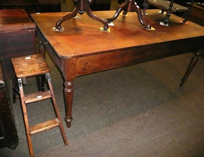 Lot 569 - A Victorian pine kitchen table with two end drawers and a set of pine ladders