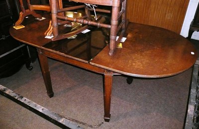 Lot 572 - A mahogany dining table