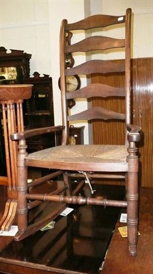 Lot 574 - A ladder back rocking chair