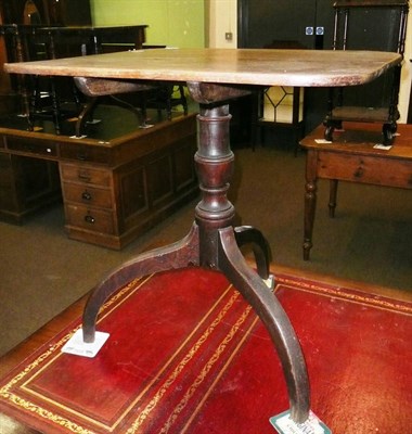 Lot 579 - An oak tripod table