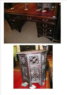 Lot 586 - A reproduction mahogany pedestal desk with leather top, and a modern Eastern fretwork table