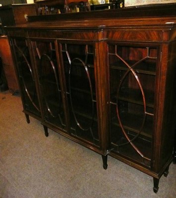 Lot 588 - A late 19th century inlaid mahogany Astragal glazed breakfront bookcase on spade feet