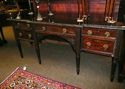 Lot 592 - A 19th century carved mahogany sideboard, stamped H Mawer and Stephenson Ltd