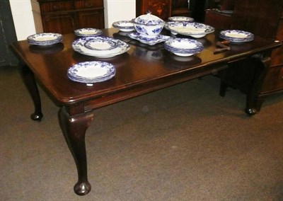 Lot 595 - Victorian mahogany wind out dining table with one leaf and winder