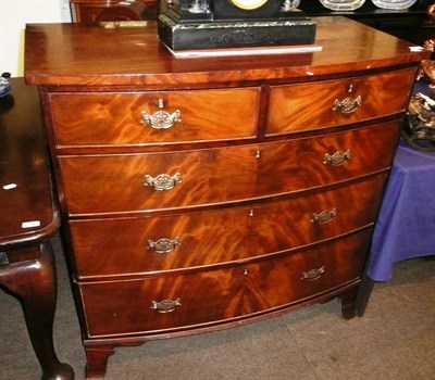 Lot 596 - A mahogany bow fronted four height chest of drawers