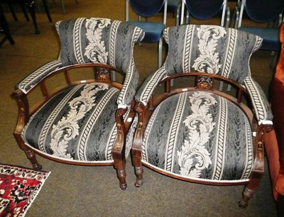 Lot 601 - A pair of Edwardian rosewood tub chairs with parquetry decoration