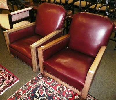 Lot 606 - Pair of red leather armchairs