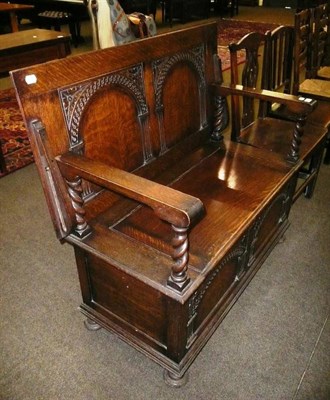 Lot 612 - A carved oak monk's bench