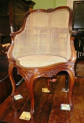 Lot 632 - 20th century Continental walnut bergere elbow chair