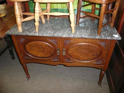 Lot 638 - A late Victorian walnut washstand with marble top and green tiled mirrored splash back