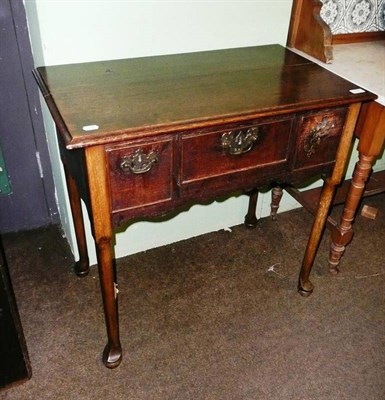 Lot 652 - Georgian oak lowboy