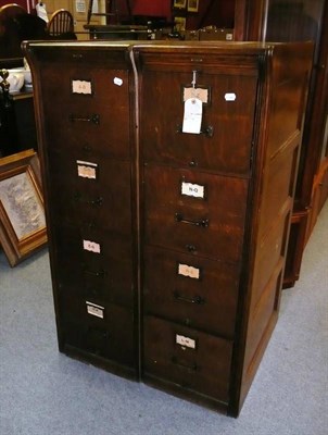 Lot 721 - A pair of early 20th century oak four drawer filing cabinets