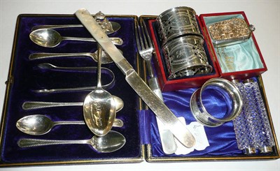 Lot 2 - A set of six silver teaspoons with sugar tongs, a silver vesta case, a pair of silver napkin rings