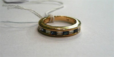 Lot 17 - A diamond and sapphire nine stone ring