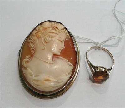 Lot 18 - A cameo brooch and an amber stone ring