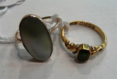 Lot 44 - An 18ct gold tourmaline ring, and a mother-of-pearl ring stamped '9CT' (2)