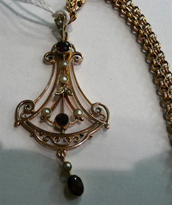 Lot 46 - An Edwardian garnet and seed pearl pendant on a fancy link chain