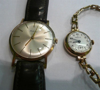 Lot 62 - A gent's wristwatch and a gold lady's bracelet wristwatch (in jewellery cabinets)