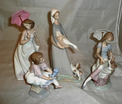 Lot 66 - Four Lladro figures, including 'Best friend' (boxed) 'Afternoon promenade' (boxed) and 'Picture...