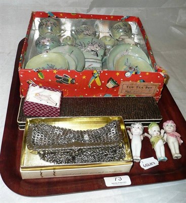 Lot 73 - A child's tea set boxed, a silver sword hat pin and two others, four miniature porcelain dolls...
