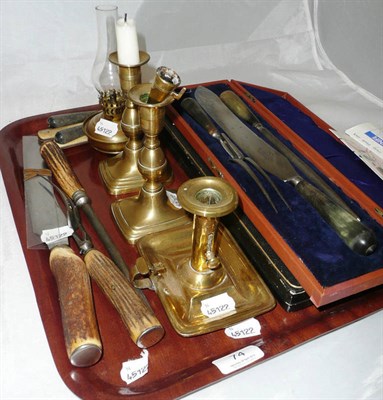 Lot 74 - A carving set, fish servers, cased, a quantity of horn handled cutlery, two brass candlesticks...