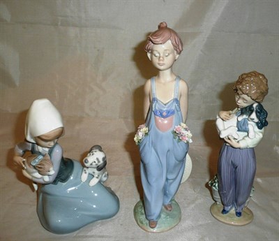 Lot 81 - Three Lladro figures, including 'Pocket full of wishes' (boxed)